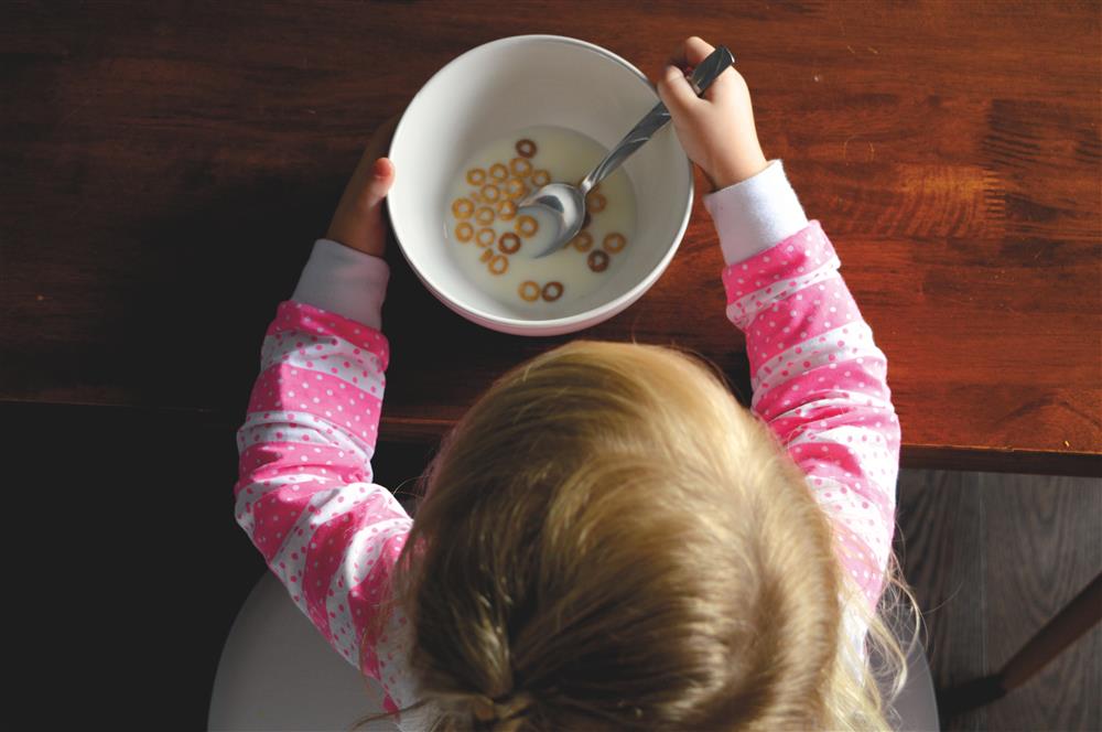 Kid with bowl of cereal